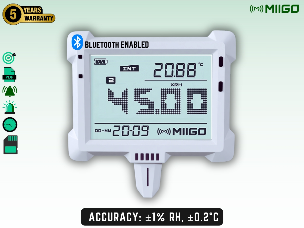 Digital thermo-hygrometer with clock and Bluetooth on a light background. Display shows temperature, humidity, and time. Features include Bluetooth enabled, 5-year warranty, and high accuracy of ±1% RH and ±0.2°C. Miigo branding present.